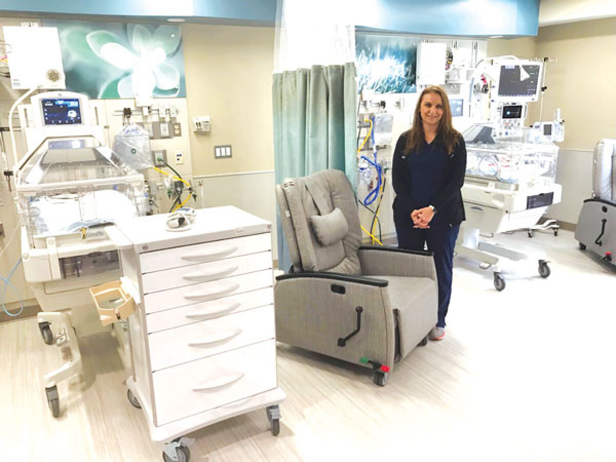  Bridget Poley, the clinical nurse manager for the NICU and pediatrics at Troy Beaumont, shows off some of the new equipment in the hospital’s new newborn intensive care unit. 