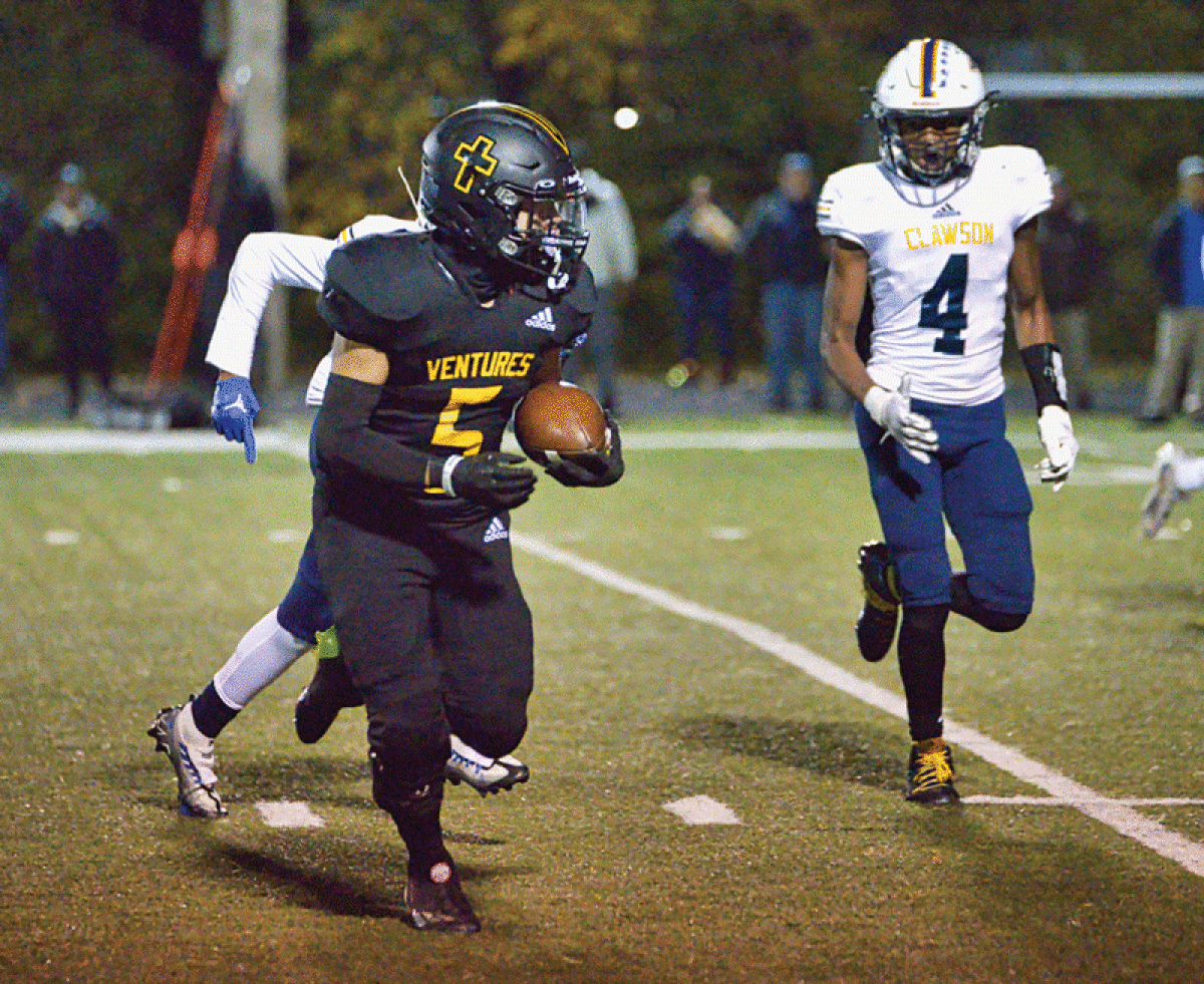  Madison Heights Bishop Foley senior Lorenzo Martinez carries the ball in the team’s 49-7 win over Clawson on Oct. 28 at Bishop Foley High School. 
