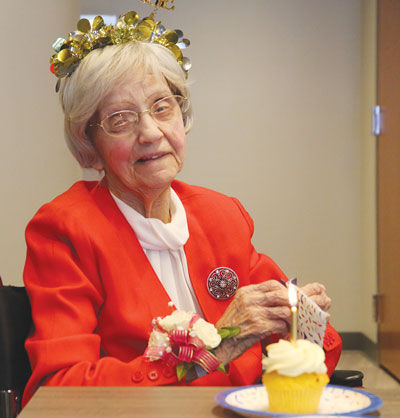  Ann Pierce, 103, gets ready to have a cupcake. Such sweets are one of a select few vices Pierce enjoys, as she credits abstaining from alcohol and smoking as key contributors to her longevity. 