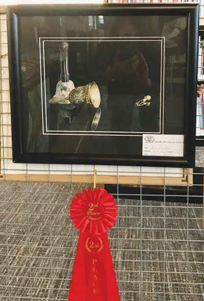   Diane Radke, who has worked in colored pencil for more than 25 years, won second place in the Library Show with “Ring My Bell.”  