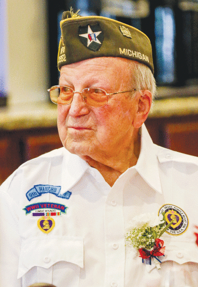  Raymond Tarabusi was honored during a D-Day luncheon at American House Elmwood June 6. Tarabusi is a World War II combat veteran who fought during the D-Day battle in Normandy. He is the recipient of two Purple Hearts for his service during the battle, as well as several other commendations. 