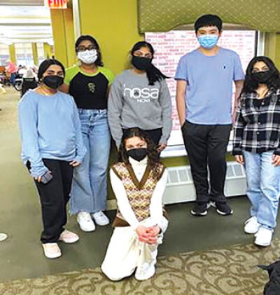  Novi High School students pose for a photo after volunteering at the Manoogian Senior Living facility during the 2022 Unity in the Community Martin Luther King Jr. Day event. 