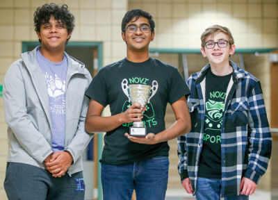  From the left, Pranav Chinniah, Kavin Kukunoor and Luke Guiboux, members of the Novi Green Super Smash Bros. Ultimate team, pose with the runner-up trophy. Not pictured is Rishi Tappeta. 