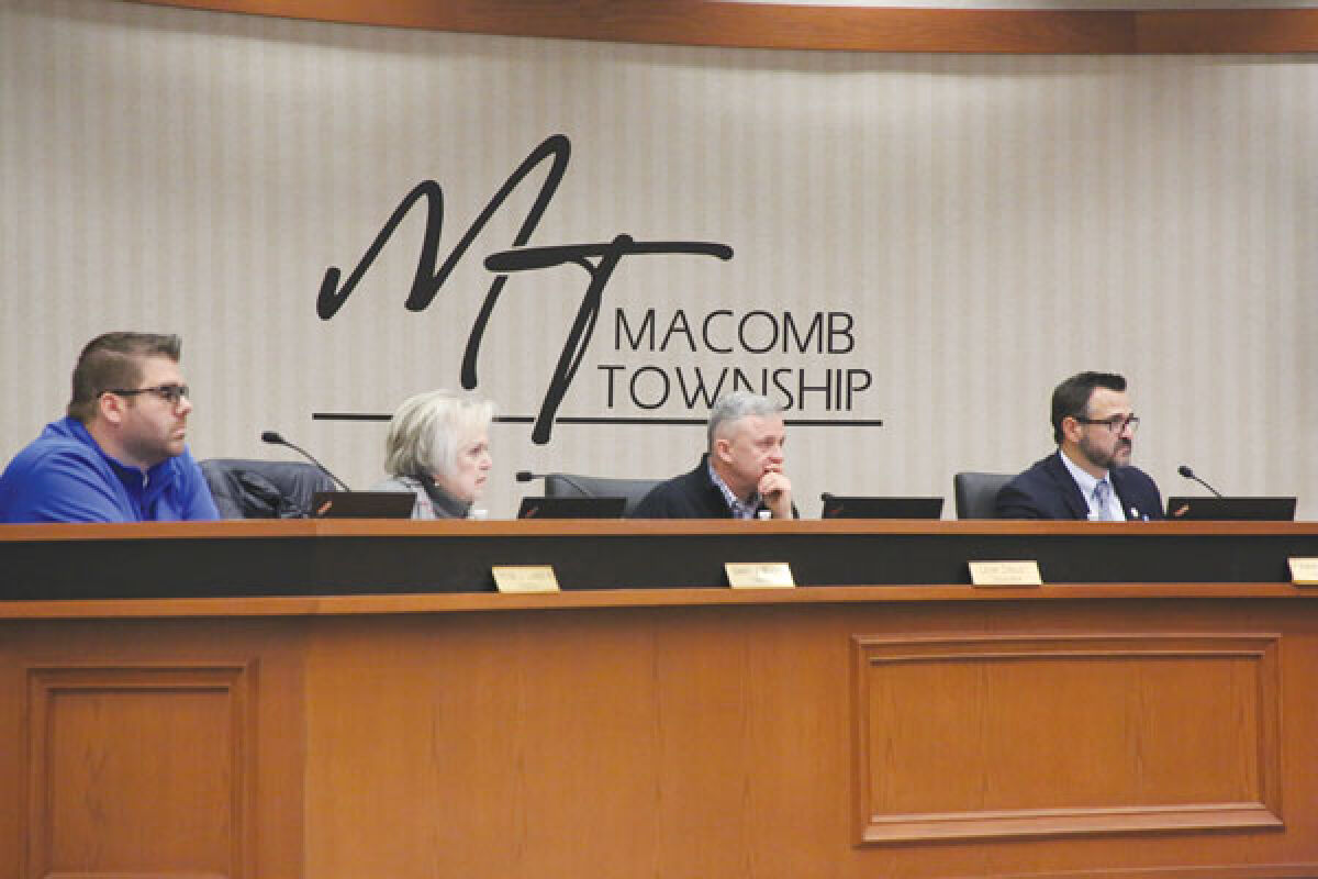  Members of the Macomb Township Board of Trustees — from left, Trustee Peter Lucido, Trustee Nancy Nevers, Treasurer Leon Drolet and Township Supervisor Frank Viviano — listen as Department of Public Works Director Kevin Johnson discusses purchasing new trucks on Jan. 11. 