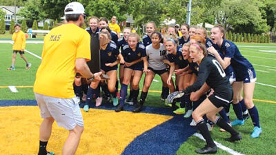  The Royal Oak Shrine Catholic High School varsity girls soccer team celebrates its second state title in four years after earning a 1-0 victory over Kalamazoo Christian High School in the Michigan High School Athletic Association Division IV state championship at Michigan State University’s DeMartin Stadium June 17. 