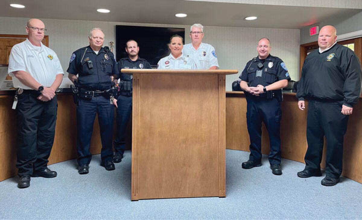  The Orchard Lake Police Department recently became part of the Hope Not Handcuffs program to help people struggling with a drug addiction. Pictured at a press conference in June are, from the left, West Bloomfield Fire Capt. Gary Proctor, Orchard Lake Police Lt. Tony Banks, Orchard Lake Police Officer Garet Malott, Southfield Fire Capt. and Families Against Narcotics Oakland County Chapter President Melissa Medici, Orchard Lake Police Chief Bill Nicholson, Orchard Lake Police Sgt. Jeff Gomez, and West Bloomfield Fire Marshal Byron Turnquist. 