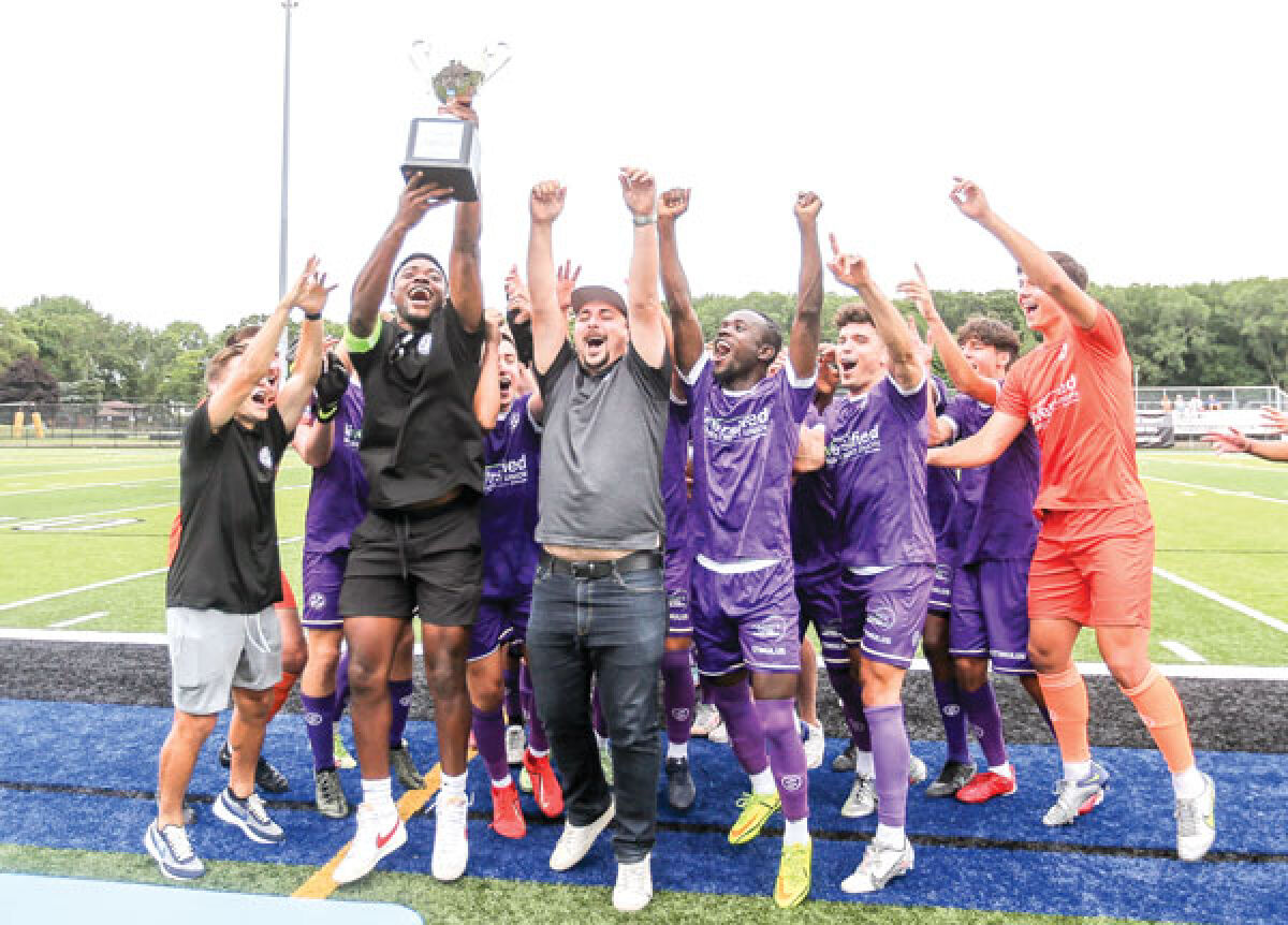  Oakland County FC celebrates its 2022 Milk Cup championship win with a trophy celebration at its final home game of 2022 on July 15. 