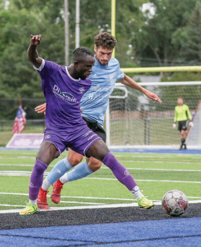  Malvin Gblah battles for control of the ball against a Kalamazoo FC player July 15. 