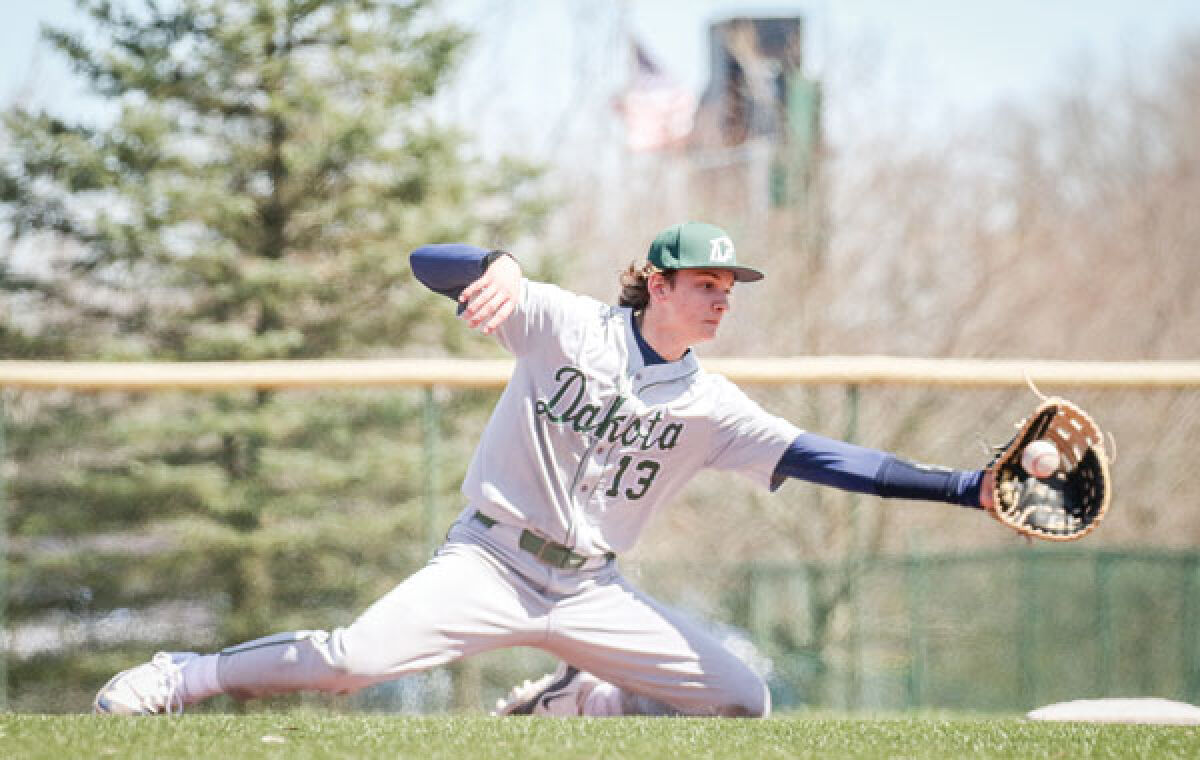  Macomb Dakota junior Luke DeMasse makes a stop at first base and gets the out in a matchup against Novi on April 13 at Novi High School. 