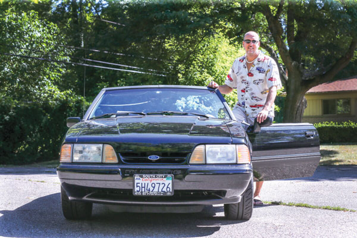  Mark Boettcher, wearing a Mustang-inspired shirt, went to California in 1997 to purchase his 1993 Ford Mustang 5.0. 