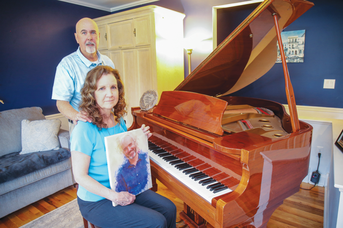  Diane and Larry Lees, of Madison Heights, with a portrait of their late son, Larry. The piano belonged to their son, who was an accomplished musician. Diane leads the Madison Heights affiliate for the nonprofit Helping Parents Heal, a group that has helped them navigate their grief.  
