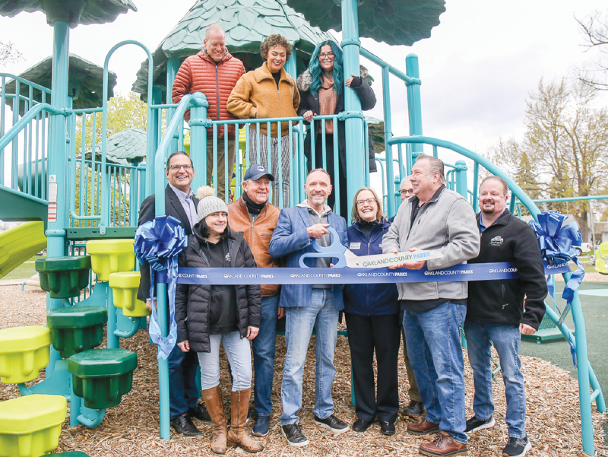  Officials from Oakland County and the city of Hazel Park cut the ribbon on the new playscape at Green Acres Park April 20. The site is four times larger than before, with new equipment and accessibility features.  