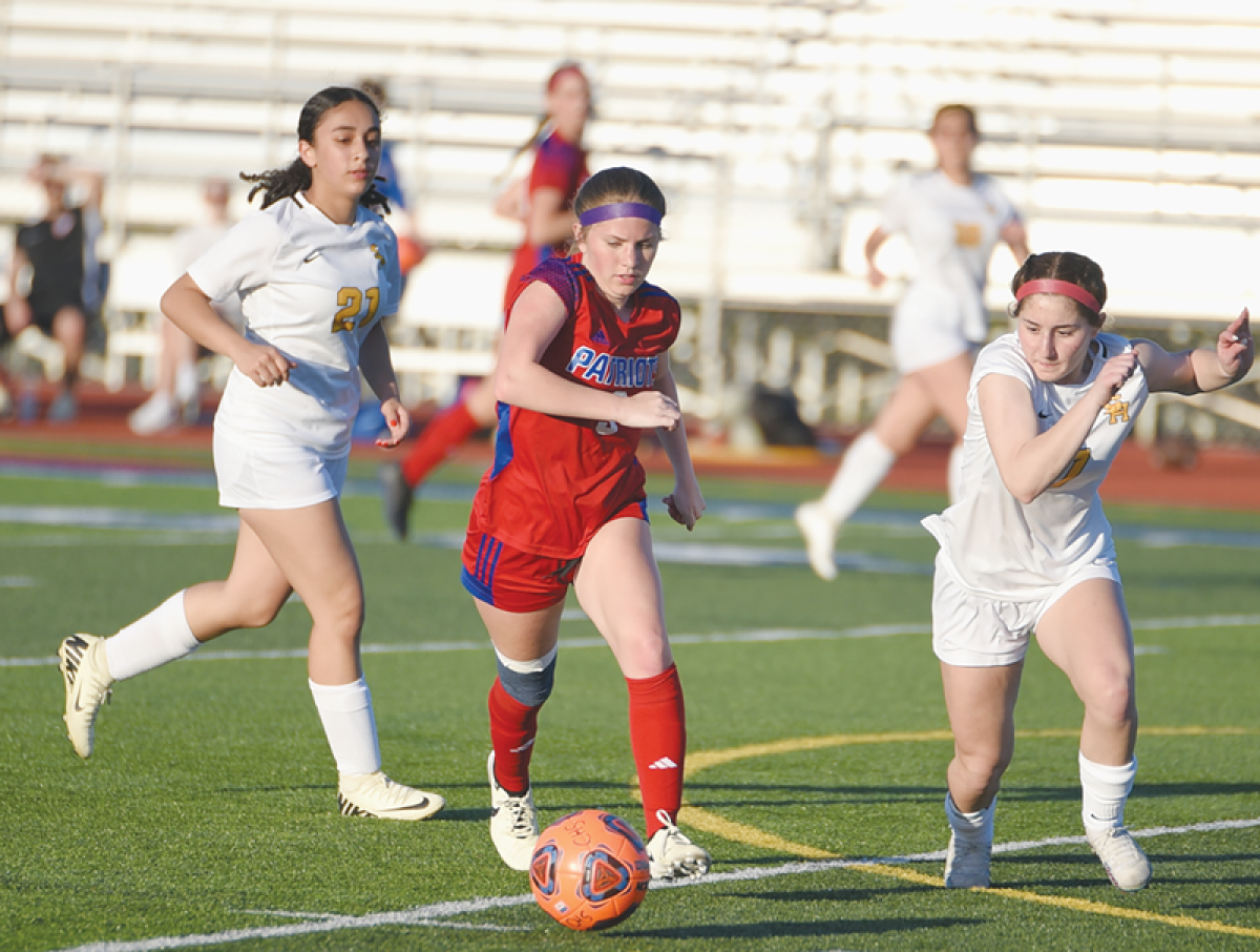  Warren Cousino sophomore Jaime Hollenbeck controls the ball during its matchup against Sterling Heights High School on May 1 at Cousino High School.  