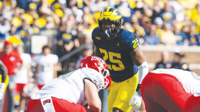  Former Michigan head coach and now Los Angeles Chargers head coach Jim Harbaugh landed his first Wolverine in the third round with the selection of linebacker Junior Colson. 