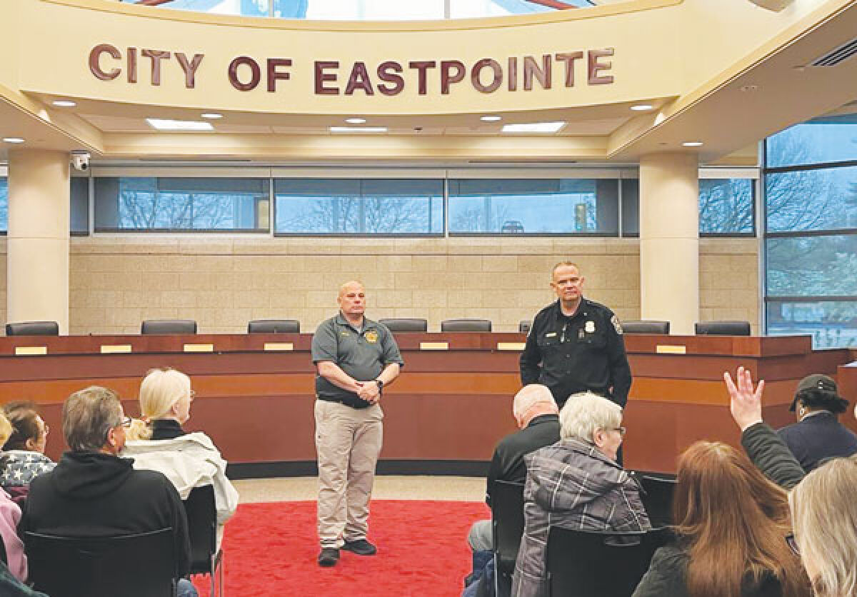  Eastpointe Fire Chief Brian Marquardt, left, and Police Chief Corey Haines listen to residents’ feedback during the Neighborhood Watch kickoff meeting April 23 inside the City Hall Council Chambers. 