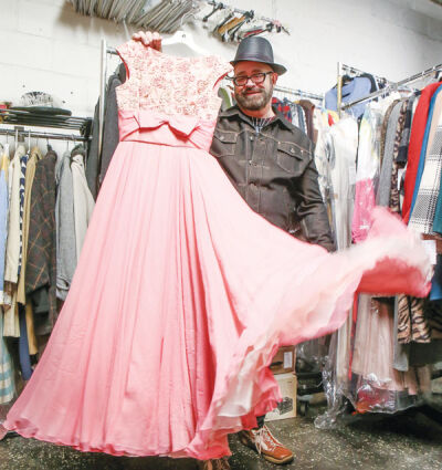  Jeffrey Ligon holds up one of the pieces that will be worn in the Art and Vintage Fashion Show May 31. 