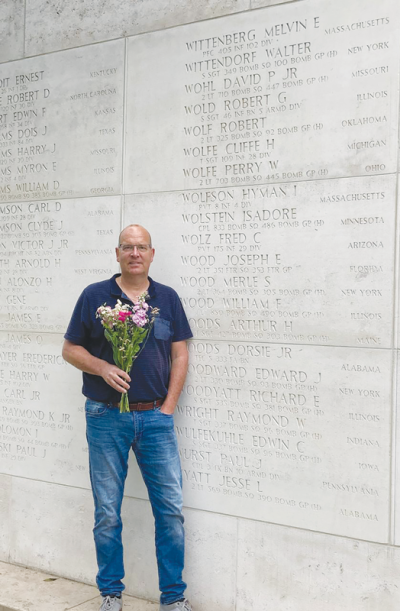   Bart van der Sterren, a resident of Schinveld, Netherlands, has adopted two soldiers, including Cliffe Hamilton Wolfe, of Detroit. Pictured here van der Sterren stands below Wolfe’s  name at the Wall of the Missing. 