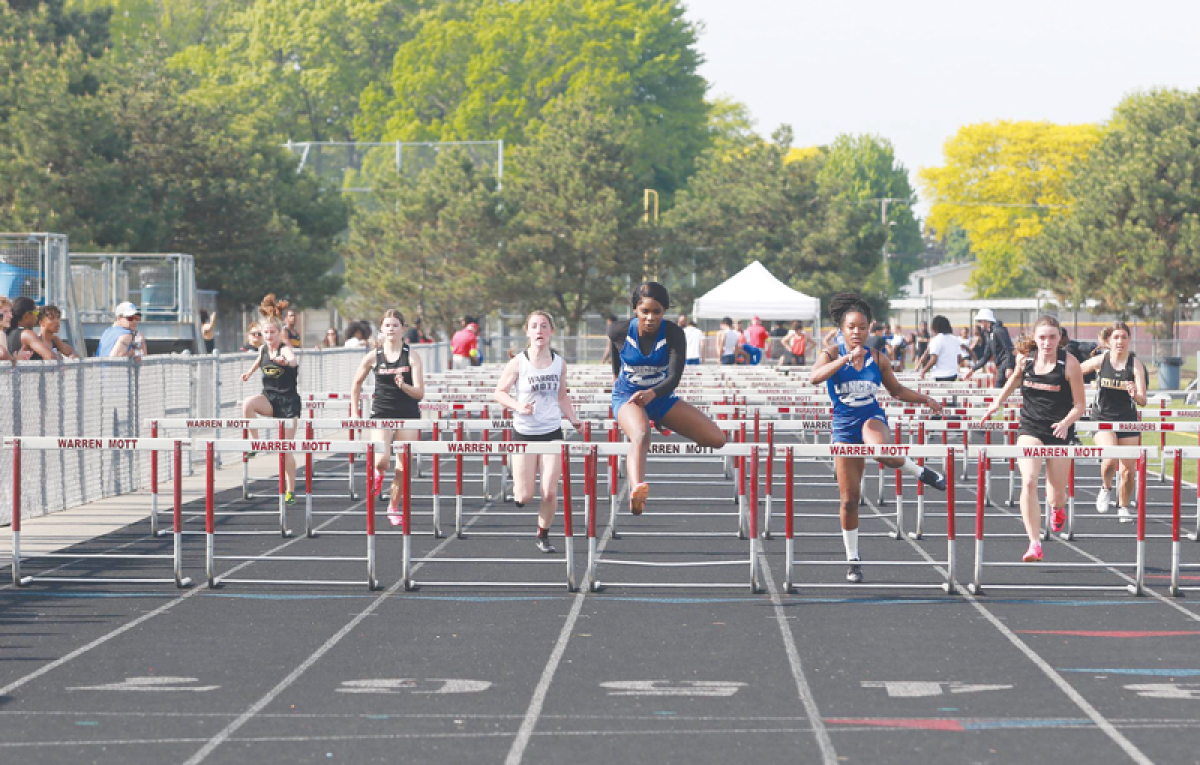  L’Anse Creuse sophomore Londyn Hollins earns first in the 100-meter hurdles at the Macomb Area Conference Blue divisional meet on May 14 at Warren Mott High School. 