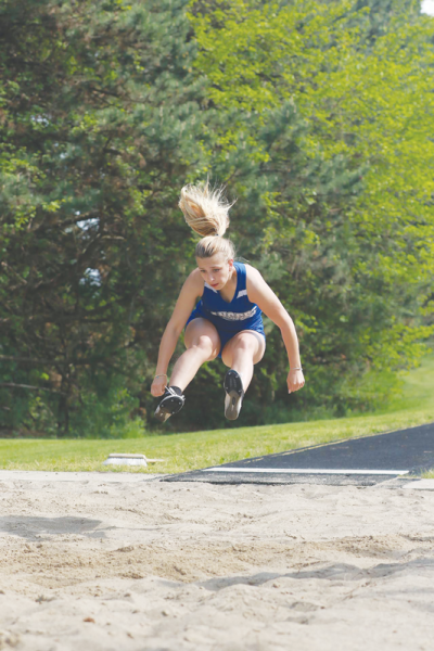  Harrison Township L’Anse Creuse freshman Emma Paige gives it her all in the long jump. 