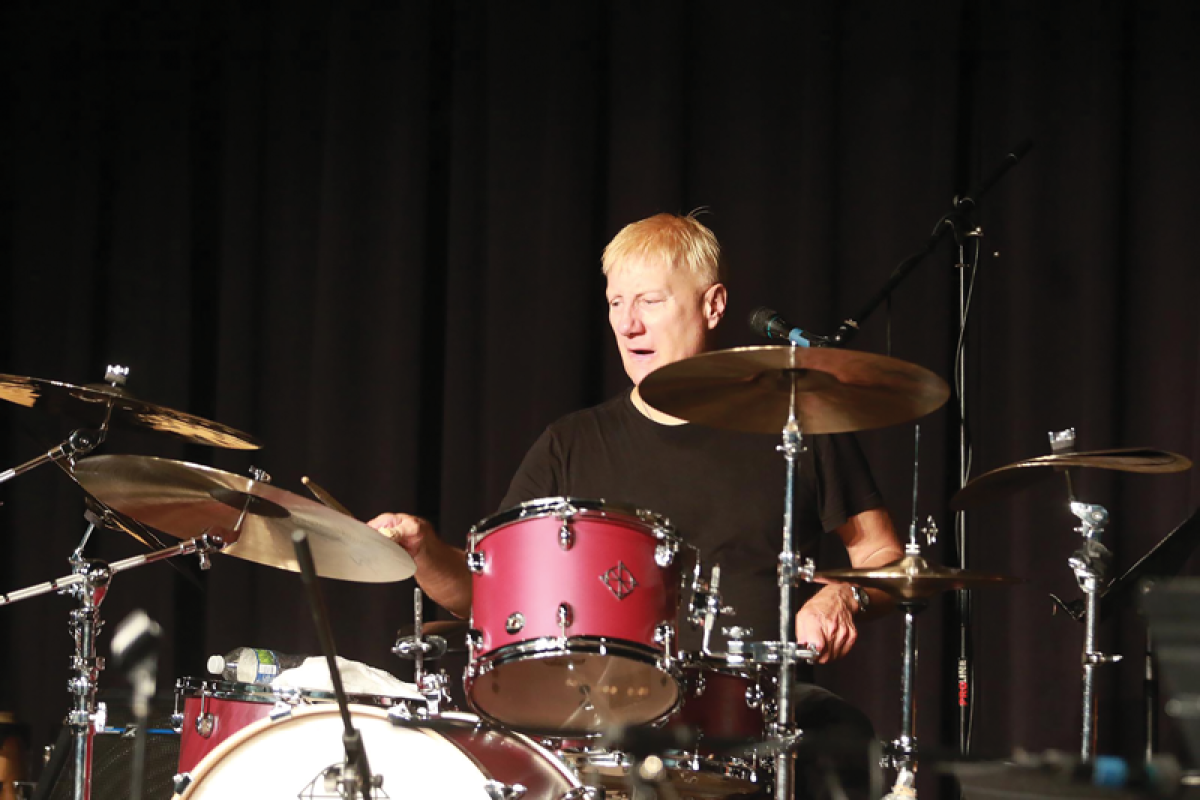  Gregg Bissonette, a 1977 Mott High School graduate who plays with Ringo Starr and His All Starr Band, performs a demonstration during a drum clinic May 9 at Warren Mott High School.  