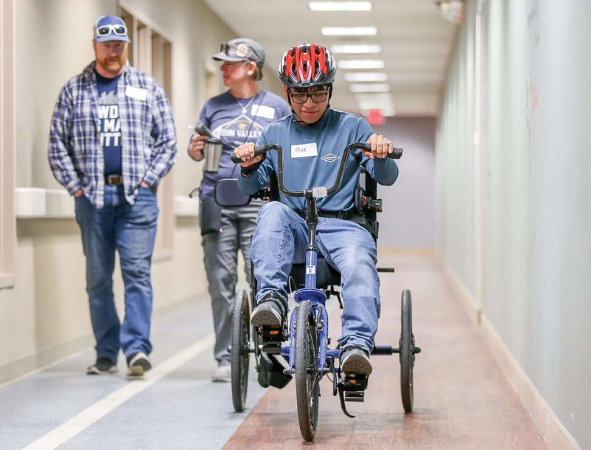  With his parents watching on, Max Decius tries out his new Trivel T-350 Adaptive Tricycle May 11 in Royal Oak. 