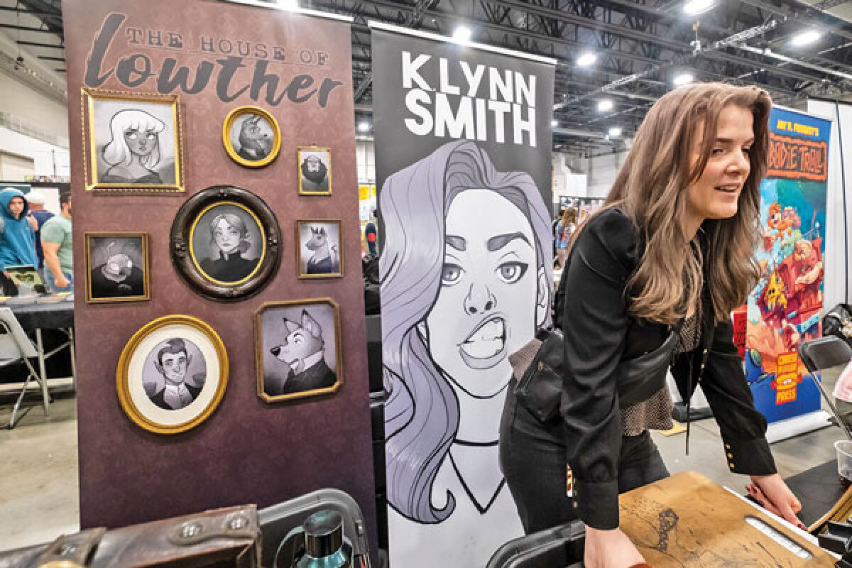  Artist K. Lynn Smith, from Mason, talks about her art Saturday, May 18, at Motor City Comic Con in Novi. 