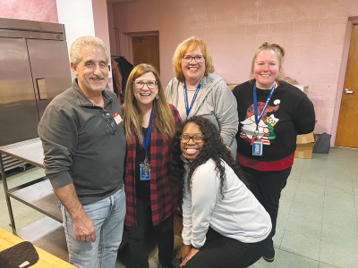   Volunteers and staff at Spaulding for Children help make a past holiday party at First Baptist Institutional Church in Detroit a great time for foster children and families. 