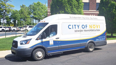  A city of Novi Senior Transportation van sits outside the Meadowbrook Medical Center. Novi Senior Transportation will be disbanded after May 31. 