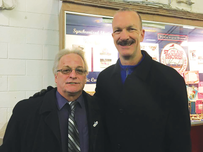  Bowling Green State University and 1980 United States men’s Olympic hockey teammates Mark Wells, left, and Ken Morrow, right, a Flint native, stand together. 