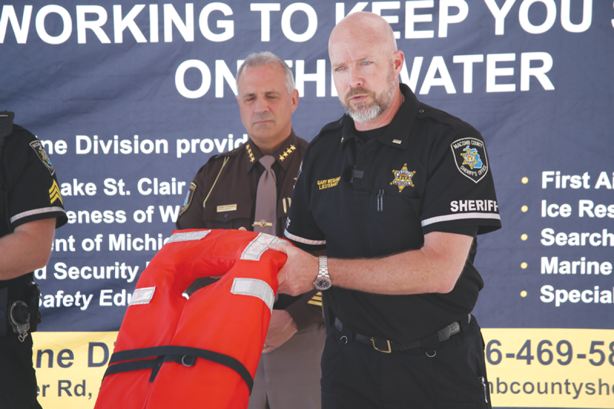  Lt. Gary Wiegand of the Macomb County Sheriff’s Office shows off an ideal life jacket for use in open water. All boats must have a life jacket for each person on board.  