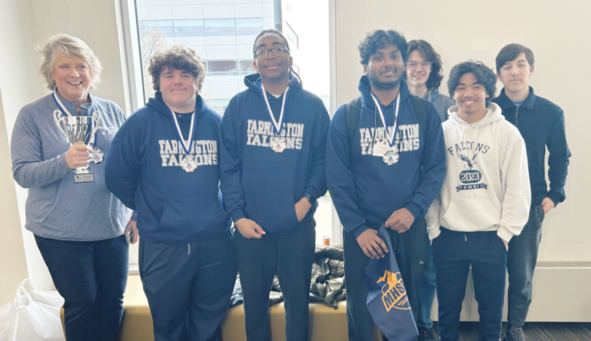  The Farmington High School esports team celebrates their runner-up finish after losing 3-2 to Detroit Catholic Central in the state championship match April 27 at Oakland University. 