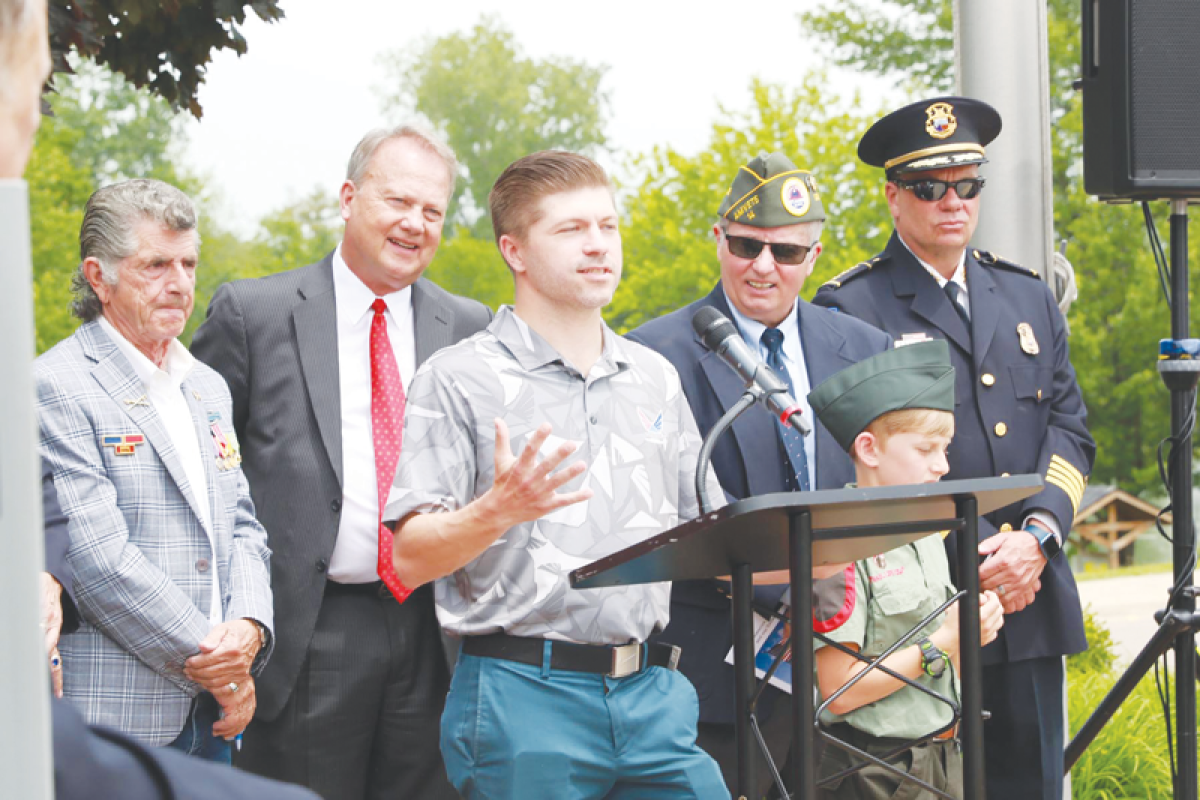  During Shelby Township’s  Memorial Day ceremony May 26, Pat Sierawski reads a letter that his grandpa wrote while serving in World War II in the Battle of Okinawa. 