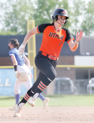  Utica senior Katelynn Perry runs to first base after a hit. 