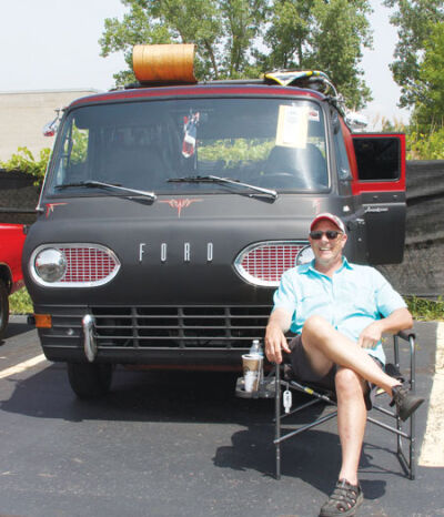  Lou Comaianni, of Clinton Township, poses for a picture with his 1964 Ford Econoline at the Remember & Honor Car-Truck-Motorcycle Show at the Knights of Columbus 33320 in Clinton Township. 