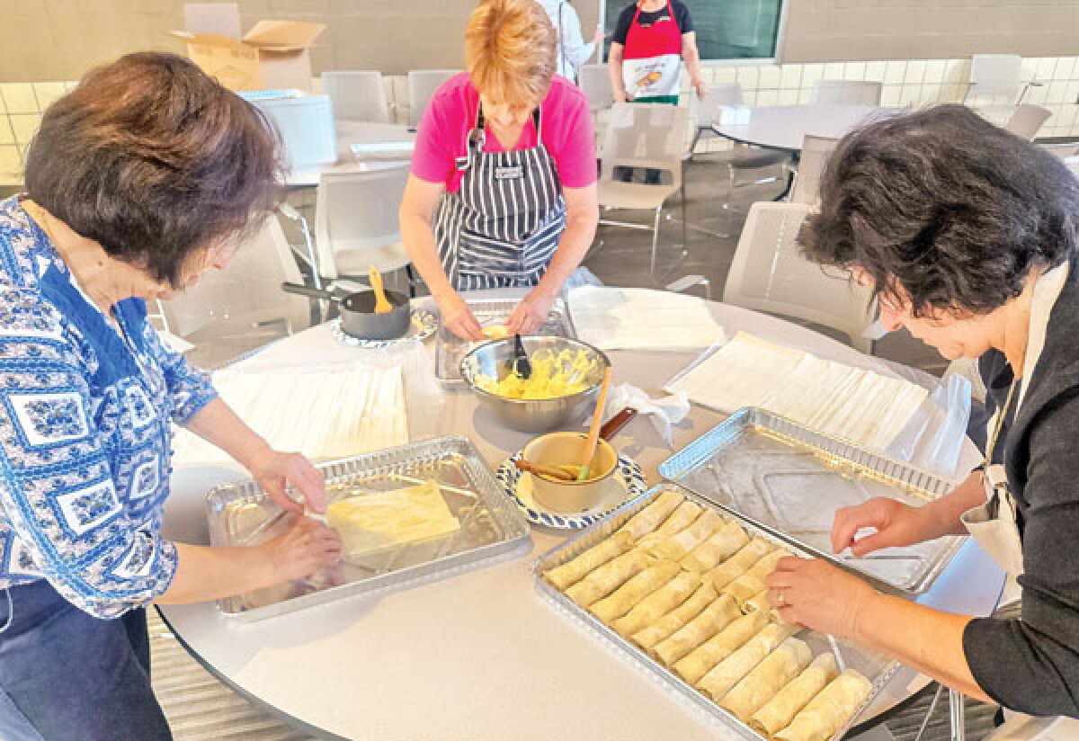  In preparation for the upcoming 2024 OPA!Fest June 21-23, volunteers bake various authentic treats June 8 at St. Nicholas Greek Orthodox Church in Troy. 