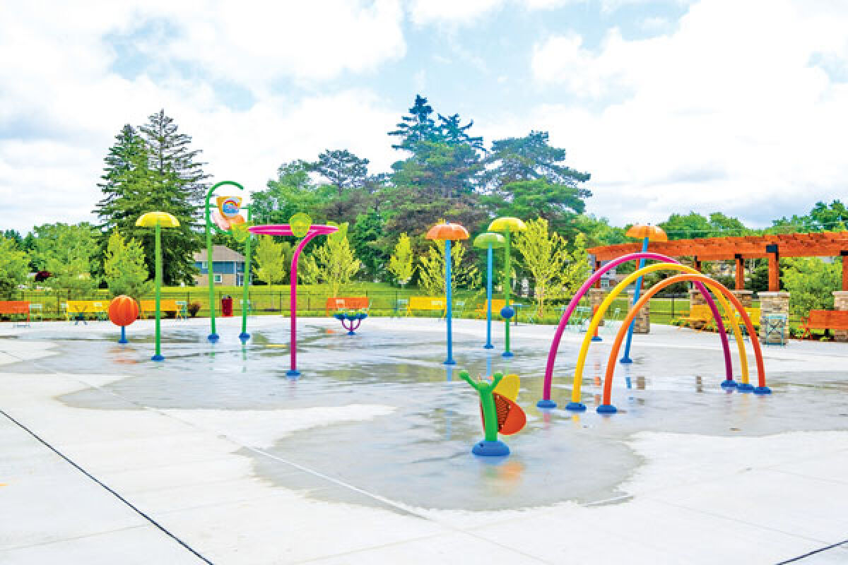  The butterfly and rainbow water features in the foreground were the ideas of Jessica Starr’s children, Noah and Riley. 