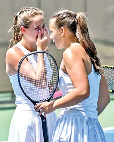  Detroit Country Day doubles flight No. 1 state champions and seniors Marin Norlander, left, and Peja Liles have a conversation on the court. 