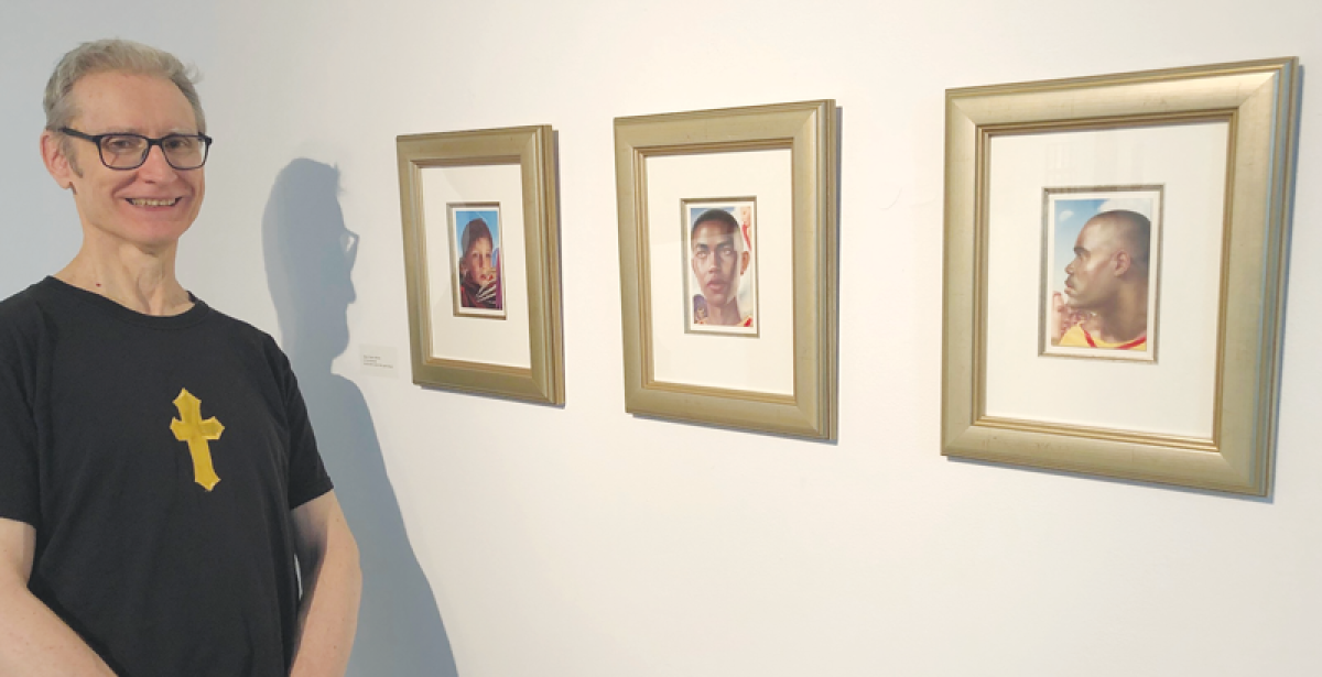  Grosse Pointe City artist Carl Demeulenaere stands next to “Arcada Triptych,” one of his works now on display at the Elaine L. Jacob Gallery on the Wayne State University campus. 