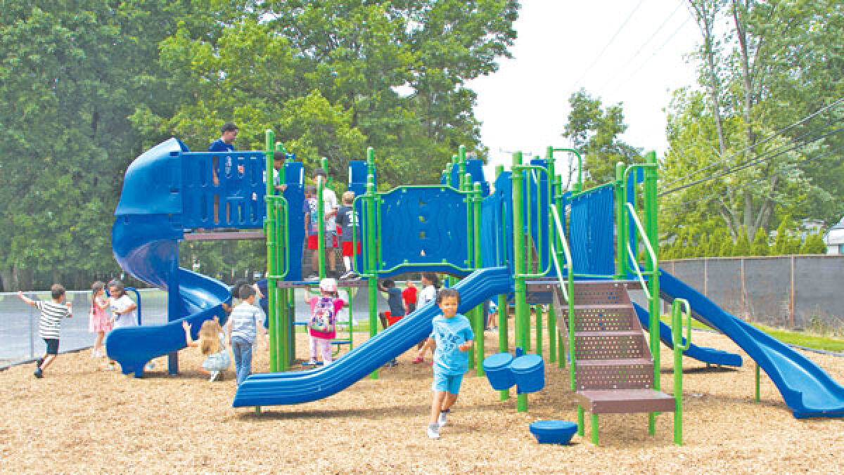  Rainbow Elementary first graders use their new playscape for the first time on June 5. 