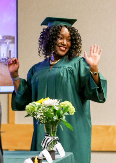  Alexandria Wachuku waves as she enters the room.  