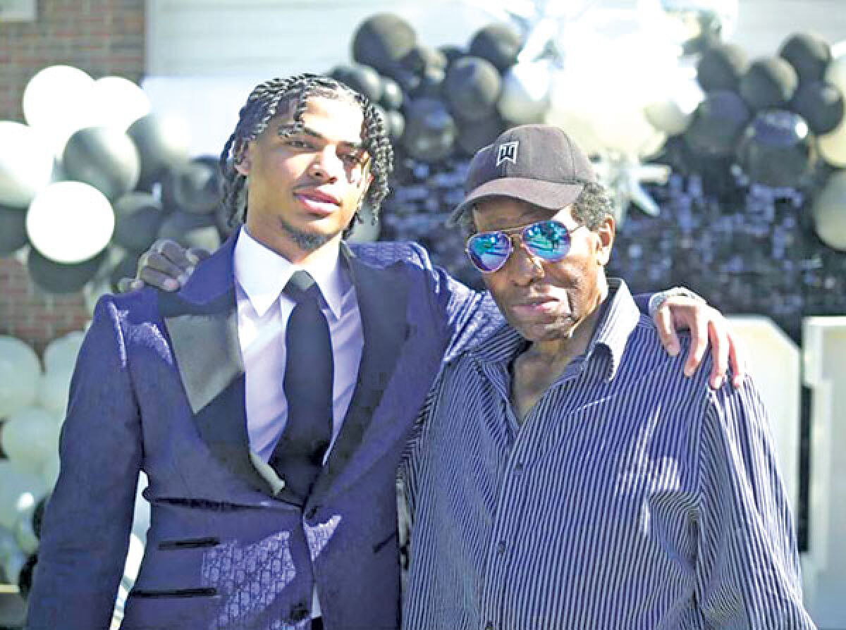  Maurice Elmore is pictured with his great-grandson, Jaylin, at his graduation shortly before Elmore’s passing. 