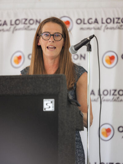  Kim Barnes Arico, University of Michigan women’s basketball head coach, speaks at an event at Olga’s Kitchen in Royal Oak June 12 where the Olga Loizon Memorial Foundation awarded $25,000 grants to three women business owners. 