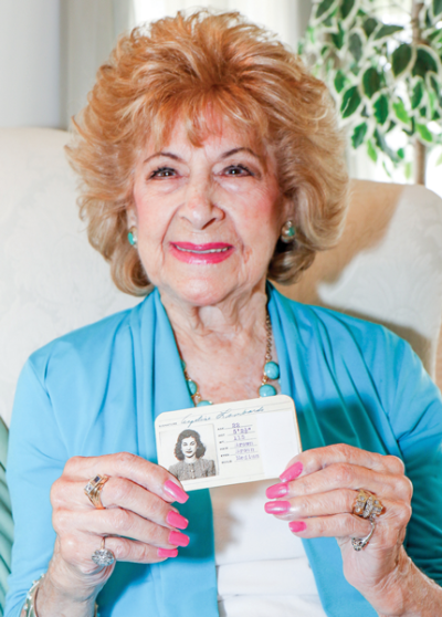   Angela Spalla, 103, worked at Michigan Central Station in the 1940s. Spalla holds her identification card from when she worked at Michigan Central Station. 