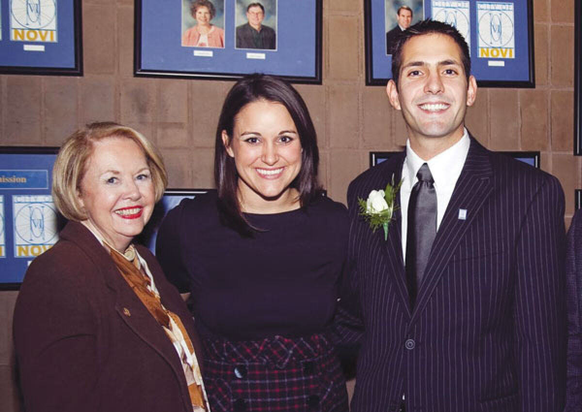  Nancy Cassis, left, poses for a picture with now-Mayor Justin Fischer and his wife, Melissa, following his election to City Council in 2009. 