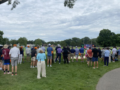  Rocket Mortgage Classic attendees look on as Rickie Fowler attempts a putt June 28 at Detroit Golf Club. 