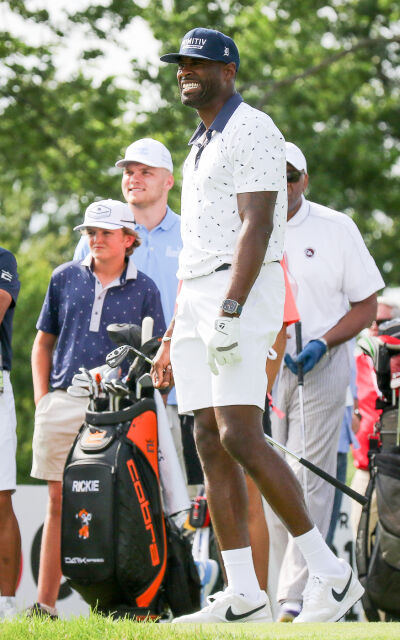  Detroit Lions legend Calvin Johnson watches his first shot on hole No. 14 land at the annual Rocket Mortgage Classic AREA 313 Celebrity Scramble on June 25 at Detroit Golf Club. 
