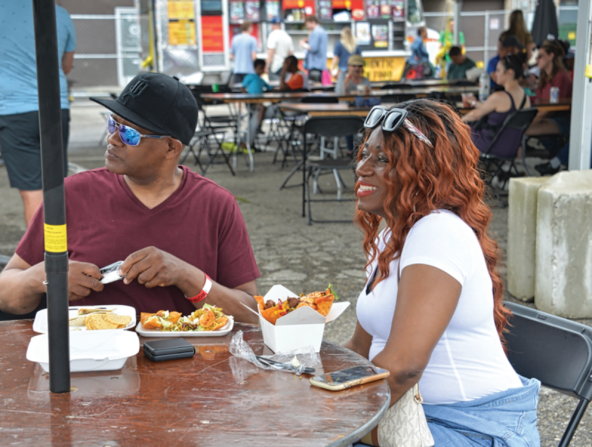  Lewis and Nicole Cash, of Dearborn Heights, enjoy the food and music at the 2023 Royal Oak Taco Fest. For 2024, the festival will have more than 100 musical acts.  