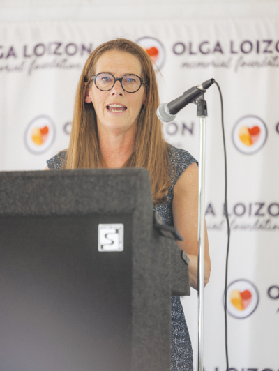  Kim Barnes Arico, University of Michigan women’s basketball head coach, speaks at an event at Olga’s Kitchen in Royal Oak June 12 where the Olga Loizon Memorial Foundation awarded $25,000 grants to three women business owners. 