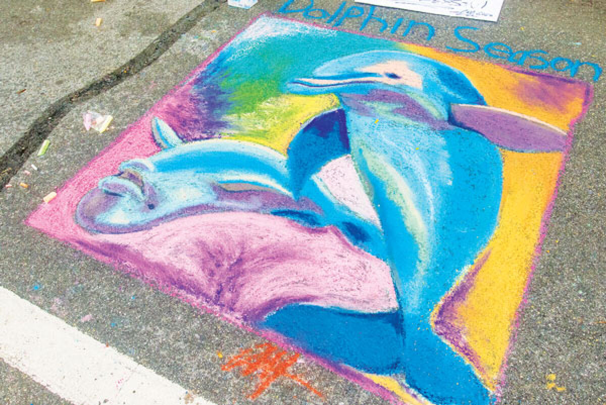 Cam Briones crafted a chalk art piece of dolphins at last year’s Berkley Street Art Fest. 