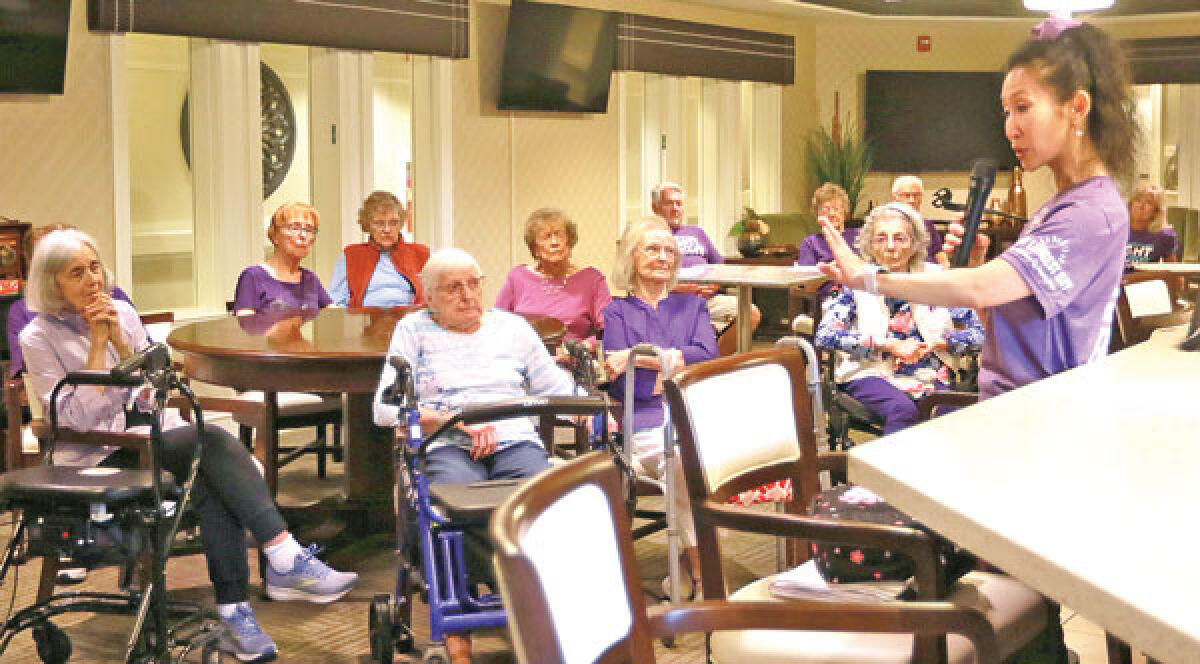  Susan Fodera leads a trivia game about Alzheimer’s disease and dementia as part of the Alzheimer’s Longest Day events at Rose Senior Living in Novi June 20. 